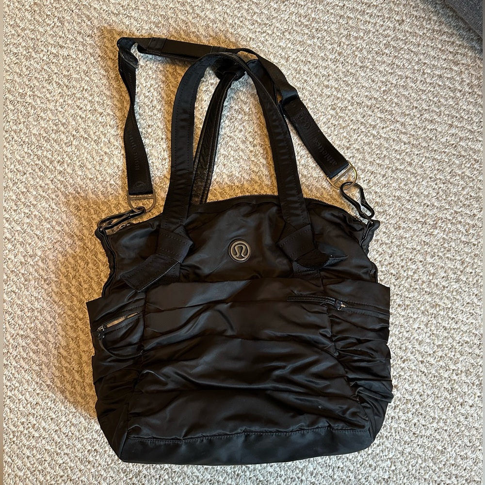 Black Lululemon bag - loads of pockets and storage!!
